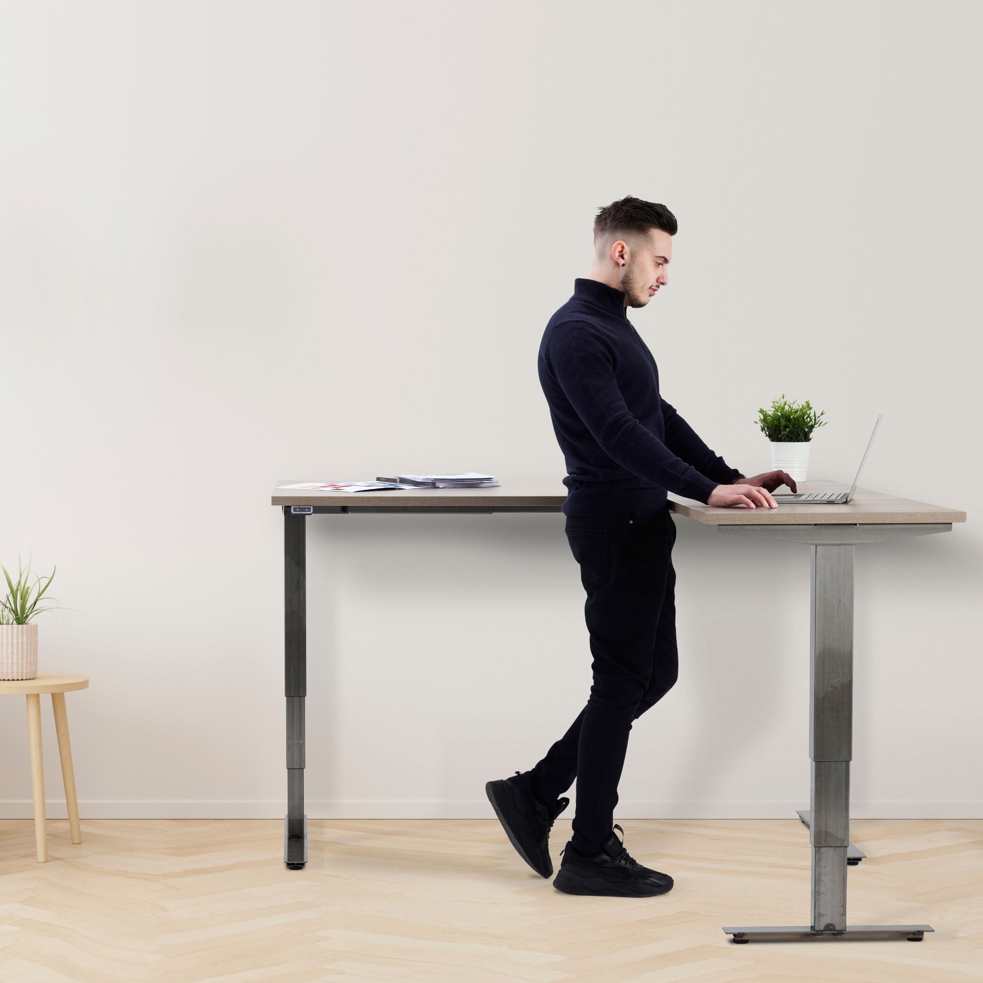 Corner Industrial Sit Stand Desk - Smyth - Man Using the Desk
